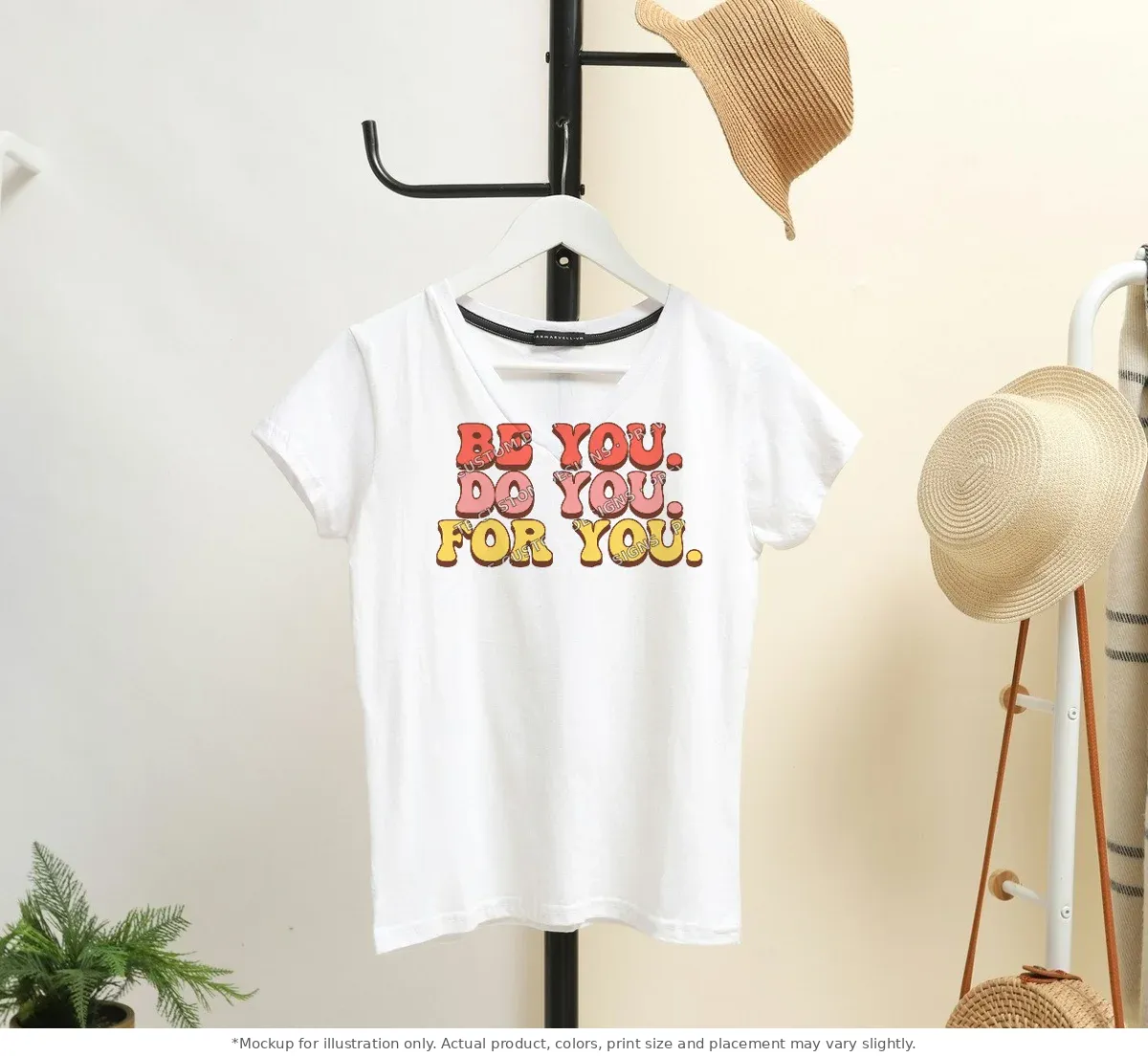 White tee mockup, on a hanger in a styled room