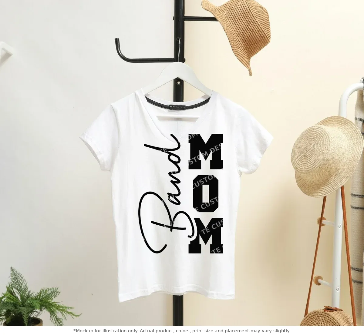 White tee mockup, on a hanger in a styled room