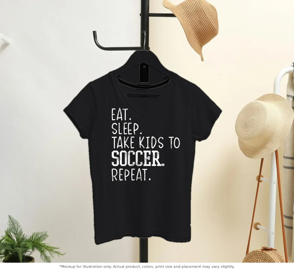 Black tee mockup, on a hanger in a styled room